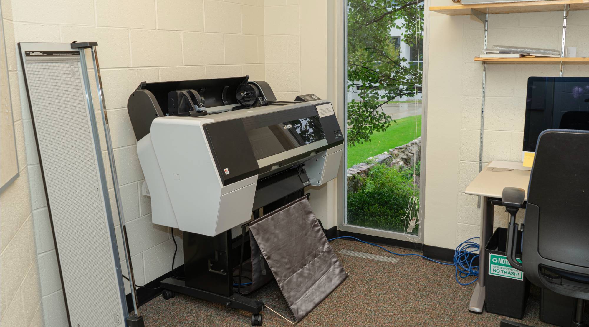 A large format printer in one of the printing suites